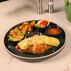 Croissant, egg & sausages